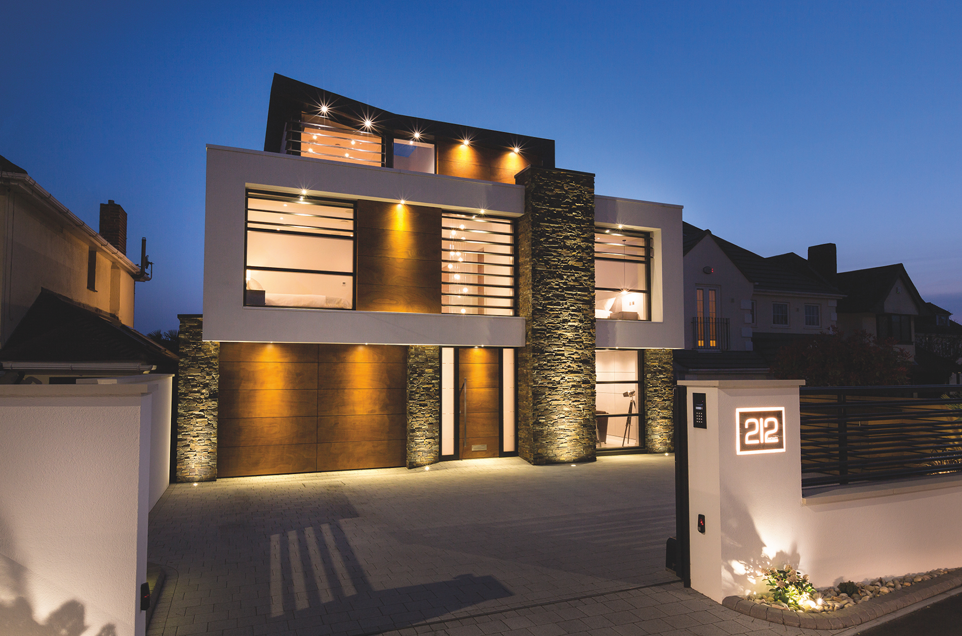 Exterior of the Sandbanks residence at dusk